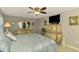 Bedroom featuring a bed, dresser, and decor that adds to the cozy atmosphere at 9321 New Martinsville Ave, Englewood, FL 34224