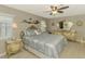 Elegant bedroom with a decorative bed frame, matching dressers, and neutral walls at 9321 New Martinsville Ave, Englewood, FL 34224