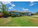 Inviting single-Gathering home with lush landscaping, mature trees, and a well-maintained lawn in a desirable neighborhood at 9321 New Martinsville Ave, Englewood, FL 34224