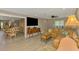 Spacious living room with a leather sectional, dining area, and stylish decor at 9321 New Martinsville Ave, Englewood, FL 34224