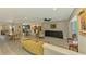 Bright and airy living space featuring gorgeous tile flooring, neutral paint, and access to kitchen and dining area at 9321 New Martinsville Ave, Englewood, FL 34224
