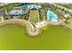 Aerial view of community lake with amenities and pool at 1007 Waterline Ct, Sarasota, FL 34240