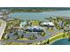 Overhead view of the community pool, clubhouse, and lake area, highlighting the community's design at 1007 Waterline Ct, Sarasota, FL 34240