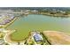 Community lake with homes and tennis courts at 1007 Waterline Ct, Sarasota, FL 34240