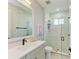 Modern bathroom featuring sleek countertops, a frameless glass shower, and contemporary fixtures at 1007 Waterline Ct, Sarasota, FL 34240