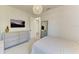 Comfortable bedroom with a soft bed, bright natural light, and a sleek dresser for a relaxing and inviting space at 1007 Waterline Ct, Sarasota, FL 34240