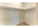 Empty walk-in closet with adjustable shelving, offering ample storage space for an organized wardrobe at 1007 Waterline Ct, Sarasota, FL 34240