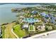 Aerial view of the resort style pool, clubhouse, lake, and recreational facilities within the community at 1007 Waterline Ct, Sarasota, FL 34240