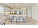 Bright kitchen features a center island with modern lighting fixtures and stainless steel appliances at 1007 Waterline Ct, Sarasota, FL 34240
