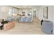 Bright, open-concept kitchen with white cabinets, stainless steel appliances, and a large island with bar seating at 1007 Waterline Ct, Sarasota, FL 34240