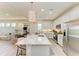 Modern kitchen boasts a large island with quartz countertops, stainless steel appliances, and an open layout at 1007 Waterline Ct, Sarasota, FL 34240