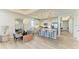 Bright living area showcases an eat-in kitchen with seating, lighting and stainless appliances at 1007 Waterline Ct, Sarasota, FL 34240