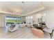 Bright and airy living room features a view to the lanai at 1007 Waterline Ct, Sarasota, FL 34240