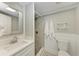 Well-lit bathroom with tiled shower and modern fixtures at 101 25Th N St # 1, Bradenton Beach, FL 34217