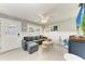 Inviting living room with gray sectional sofa, decorative furnishings, and ample natural light at 101 25Th N St # 1, Bradenton Beach, FL 34217