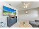 Bright living room featuring a mounted TV, light wood floors, and modern coastal decor at 101 25Th N St # 1, Bradenton Beach, FL 34217
