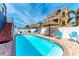 Beautiful pool area with sun loungers and shade umbrellas for relaxation at 101 25Th N St # 1, Bradenton Beach, FL 34217