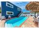 The backyard pool is the perfect oasis surrounded by chairs and a barbecue at 101 25Th N St # 1, Bradenton Beach, FL 34217
