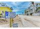 Beach access street view featuring the coastal management sign and nearby beachside homes at 101 25Th N St # 1, Bradenton Beach, FL 34217