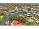 Panoramic aerial showcasing the waterfront home, canal, and distant ocean view at 1038 Contento St, Sarasota, FL 34242
