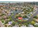 Aerial view of a waterfront community featuring lush tropical landscaping, private boat docks, and access to beaches at 1038 Contento St, Sarasota, FL 34242