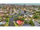 Aerial view of a waterfront community featuring lush tropical landscaping, private boat docks, and access to beaches at 1038 Contento St, Sarasota, FL 34242