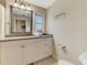 Bathroom with a single sink, a gray countertop, and a decorative mirror at 1038 Contento St, Sarasota, FL 34242