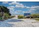 Scenic path leading to Siesta Key Beach with a welcoming sign and lush foliage, promising a serene beach experience at 1038 Contento St, Sarasota, FL 34242
