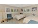 Bedroom with two twin beds, shuttered windows, ceiling fan and beach-themed decor at 1038 Contento St, Sarasota, FL 34242