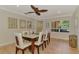 Dining area with glass top table, seating for six, and decoratively framed mirrors at 1038 Contento St, Sarasota, FL 34242
