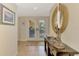 Bright entryway featuring a console table with decorative items and a view to the outdoor patio at 1038 Contento St, Sarasota, FL 34242