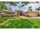 Beautiful well maintained house with brick entrance and green landscaping, freshly cut grass at 1038 Contento St, Sarasota, FL 34242