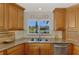 This eat-in kitchen features granite counters and stainless appliances at 1038 Contento St, Sarasota, FL 34242