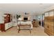 Spacious living room featuring a ceiling fan, sliding glass doors, and stylish coastal décor at 1038 Contento St, Sarasota, FL 34242