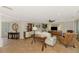 Inviting living room with tile flooring, comfortable seating, and plenty of natural light at 1038 Contento St, Sarasota, FL 34242