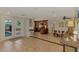 Open living space with a kitchen, dining area, and access to a patio with a pool view at 1038 Contento St, Sarasota, FL 34242