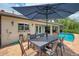 Outdoor dining area with patio and pool view and access at 1038 Contento St, Sarasota, FL 34242