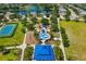 Aerial view of community park amenities including splash pad, playground, and covered seating areas at 11634 Piedmont Park Xing, Bradenton, FL 34211