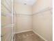 Walk-in closet features neutral walls, carpet and wire shelving perfect for organizing clothes at 11634 Piedmont Park Xing, Bradenton, FL 34211