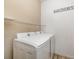 Functional laundry room with modern washer, dryer, and convenient shelving at 11634 Piedmont Park Xing, Bradenton, FL 34211