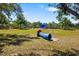 Community playground features a crawl tunnel, picnic tables, sunshades and a large green playing field at 11634 Piedmont Park Xing, Bradenton, FL 34211