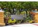 Signage for community, with lush landscaping and trees at 11634 Piedmont Park Xing, Bradenton, FL 34211