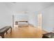 Spacious main bedroom with hardwood floors, ceiling fan, and an en-suite bathroom with modern fixtures at 1502 Water Oak S Way, Bradenton, FL 34209