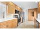 Spacious kitchen featuring stainless steel appliances and generous cabinet space at 1502 Water Oak S Way, Bradenton, FL 34209