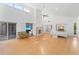 Open living space with fireplace, tiled floors, high ceilings and access to additional rooms at 1502 Water Oak S Way, Bradenton, FL 34209