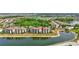 An aerial shot showcases this condo community's prime location near a lake and golf course at 17118 Vardon Ter # 304, Bradenton, FL 34211