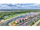An aerial view of a luxurious community with a golf course, lakes, and pristine landscaping at 17118 Vardon Ter # 304, Bradenton, FL 34211