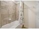 Bathroom tub with tiled wall and shower curtain plus towel bar at 17118 Vardon Ter # 304, Bradenton, FL 34211