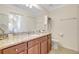 Bathroom boasts granite countertops, storage cabinets and drawers, plus a toilet at 17118 Vardon Ter # 304, Bradenton, FL 34211