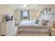 This bedroom features a serene view, ceiling fan, and a comfortable bed setup at 17118 Vardon Ter # 304, Bradenton, FL 34211